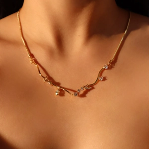 Elegant 18k gold plated snake chain necklace with zircon waves and blue crystals