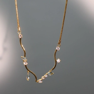 Elegant 18k gold plated curved wave pendant necklace with white zircons on snake chain