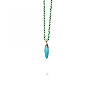 Macro view of a blue pepper pendant on a green beaded necklace with 18k gold plating