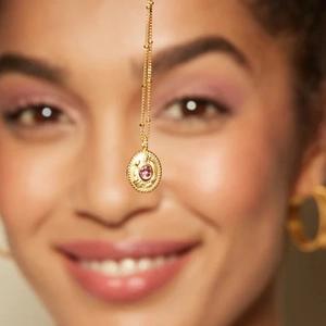 18k gold stainless steel necklace with pink birthstone pendant and ornate embossing