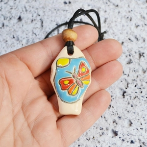 Handcrafted ceramic butterfly whistle necklace with colorful hand-painted design