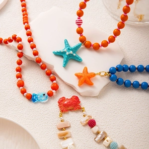 Summer ocean themed colorful beaded necklace with starfish crab and fish charms