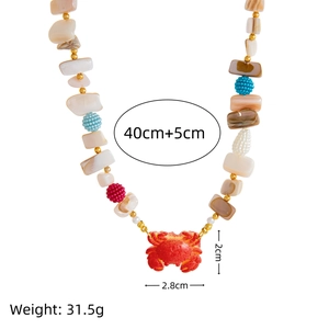 Bohemian ocean shell necklace with red crab pendant and colorful beaded starfish elements