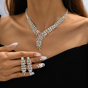 Elegant silver bridal jewelry set with sparkling rhinestones and leaf tassels