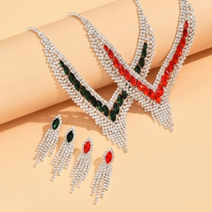 Elegant V-shaped silver bridal jewelry set with sparkling rhinestones and green gems