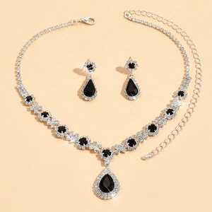 Detail of silver waterdrop jewelry set with black crystals and sparkling rhinestones