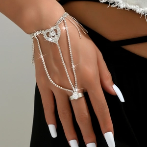 Elegant silver slave bracelet with large rhinestone heart and sparkling fringe details
