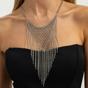 Punk style silver chain fringe bib necklace with layered tassels on female model