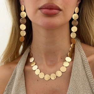 Golden brushed metal disk necklace and long tassel earrings set for women