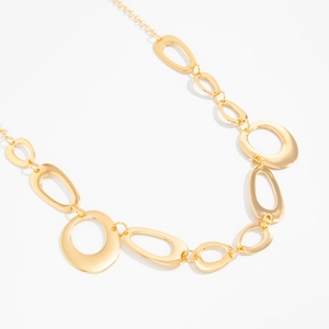 Detailed macro view of irregular gold metal hollow ring links for fashion body chain