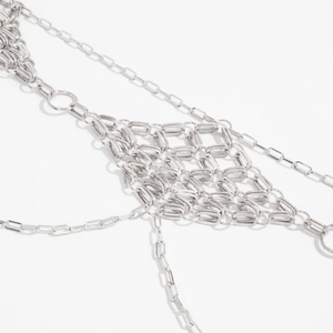 Close-up of silver metal diamond-mesh waist chain with woven rectangular links