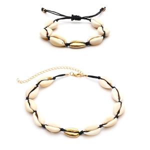 Handmade shell necklace and bracelet set with golden centerpieces for summer beach wear