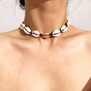 Handmade Bohemian seashell choker necklace featuring a central gold plated shell accent