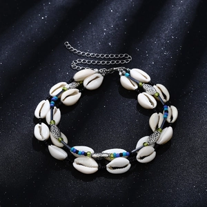 Close-up of double-layer shell necklace with colorful beads and adjustable chain