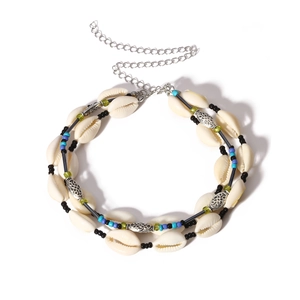Detail of bohemian shell necklace with colorful beads and adjustable silver chain link