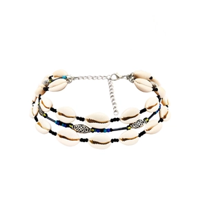Detail of bohemian triple-layer shell necklace with colorful beads and silver clasp