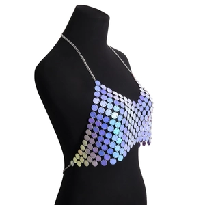 Detail of holographic purple sequin body chain with metallic rings on a black mannequin