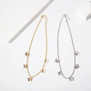 Detail of gold and silver butterfly choker necklaces with fine O-chains and lobster clasps