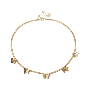 Detail view of gold butterfly pendant necklace with five charms and adjustable chain
