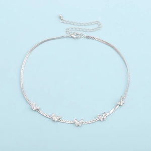 Detail shot of silver snake chain necklace with five sparkling crystal butterfly pendants