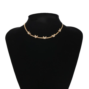 Detail of elegant gold butterfly choker featuring crystal-paved charms on thin chain