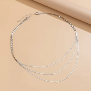 Detail of silver snake bone chain featuring multi-layered tiered design and braided texture