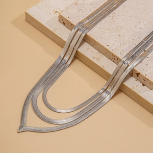 Triple-layered silver herringbone snake chain necklaces with flat geometric metallic links