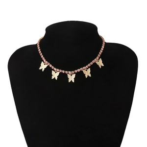 Detailed shot of pink crystal choker with five textured golden butterfly pendants