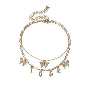 Detail view of double-layer gold butterfly necklace with LOVE charms on a thin chain
