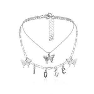 Detail of double layered butterfly necklace with Figaro chain and LOVE letter charms