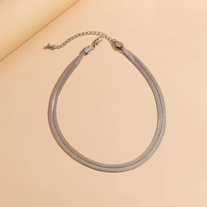 Detail of silver double-layered snake chain necklace with lobster clasp and extender chain