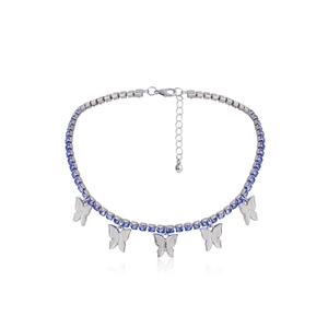 Detail of silver butterfly necklace with blue rectangular crystals and pavé zircon pendants