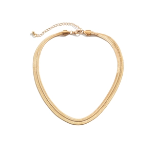 Detailed view of double-layer gold snake chain necklace with lobster clasp and extension