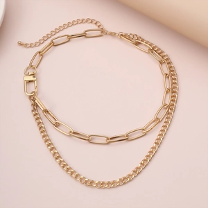 Hip hop style gold layered paperclip chain necklace with a modern industrial buckle