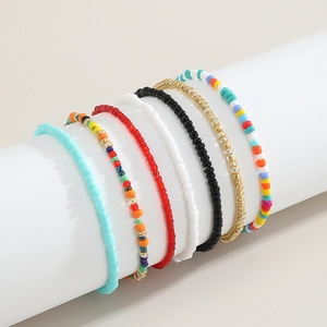 Detail of seven colorful handmade beaded waist chains in bohemian summer style