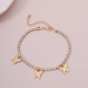 Close-up of gold butterfly bracelet with shimmering rhinestones and adjustable clasp