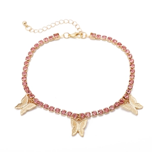 Macro view of golden butterfly necklace with pink rhinestones and adjustable clasp
