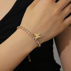 Detail of a dainty gold butterfly bracelet with crystal pavé and adjustable link chain