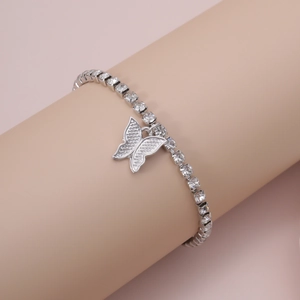 Detail of silver butterfly tennis necklace with clear cubic zirconia on neck