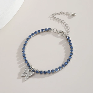 Detail view of silver butterfly necklace with blue crystals and adjustable lobster clasp