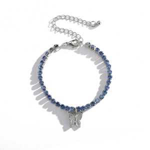 Detail view of silver tennis chain with blue zircons and sparkling butterfly pendant