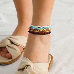 Detail of colorful multilayered glass seed bead body chains in bohemian style for women