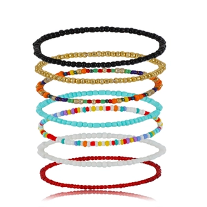 Detailed macro view of 7pcs colorful Bohemian beaded stretch bracelets in stacked layout