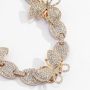 Luxuriöse goldene Schmetterlingshalskette mit vollem Strassbesatz und kubanischen Gliedern