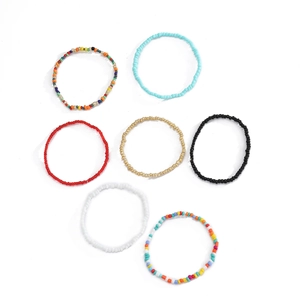 Set of seven bohemian beaded stretch bracelets in vibrant assorted colors for women