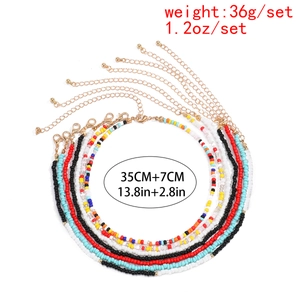 Macro view of multi-layer colorful seed bead waist chain with golden clasp and extender
