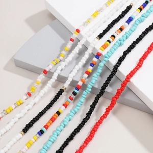Detailed view of colorful seed bead waist chains and multi-layer body jewelry styles