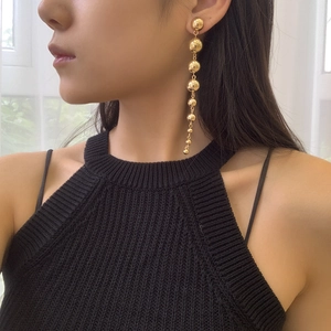 Women's punk style multi-bead drop earrings in polished gold metal finish