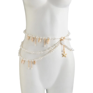 Close-up of multilayered pearl waist chain with seashell and starfish pendants
