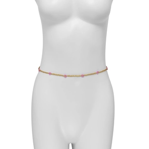 Detail of pink floral beaded waist chain with gold beads on a white mannequin